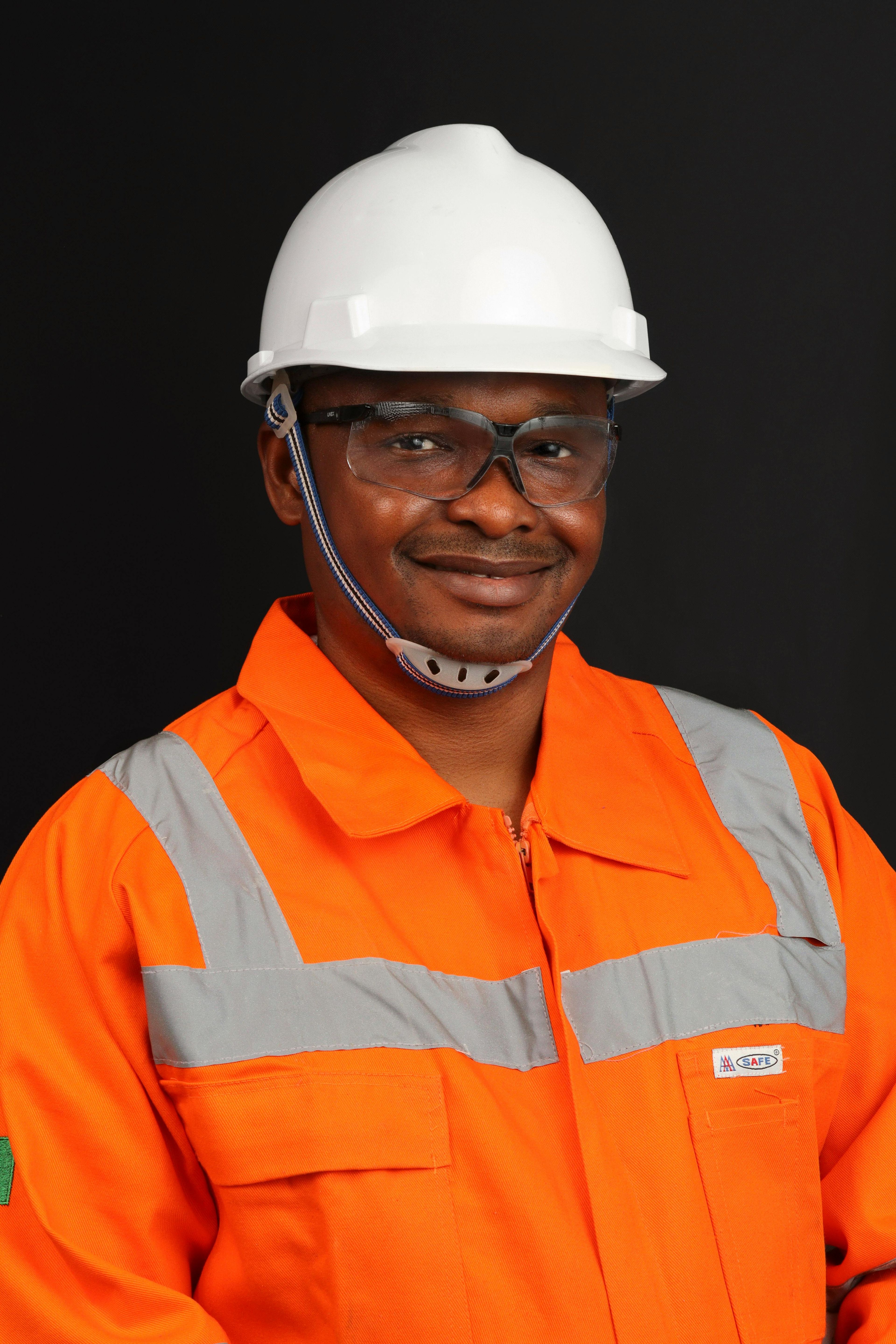 Men in helment and orange workmen suit
